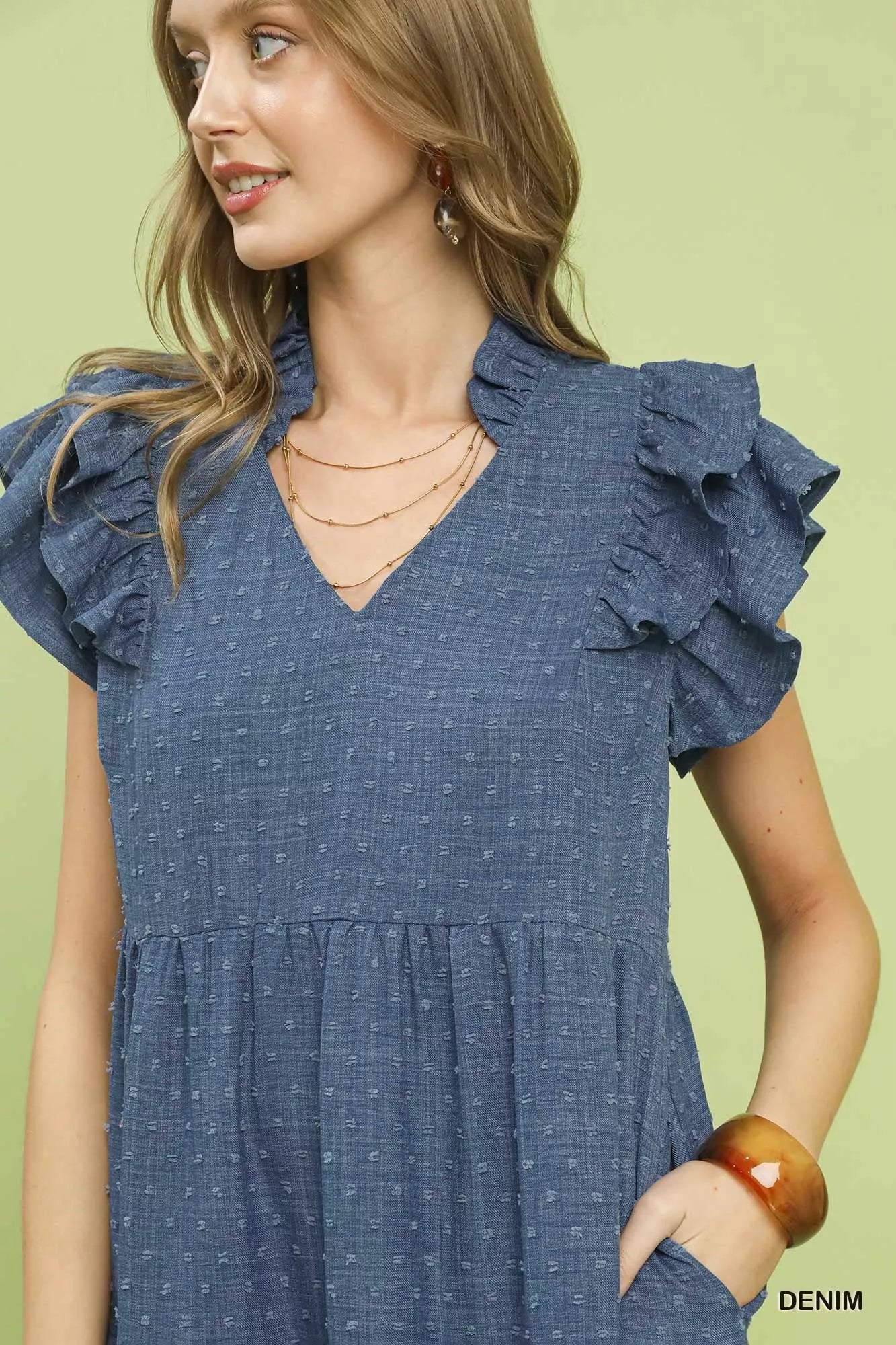 Umgee textured ruffle sleeve tiered midi dress shown in a stylish, flowy silhouette with layered fabric and ruffle details.