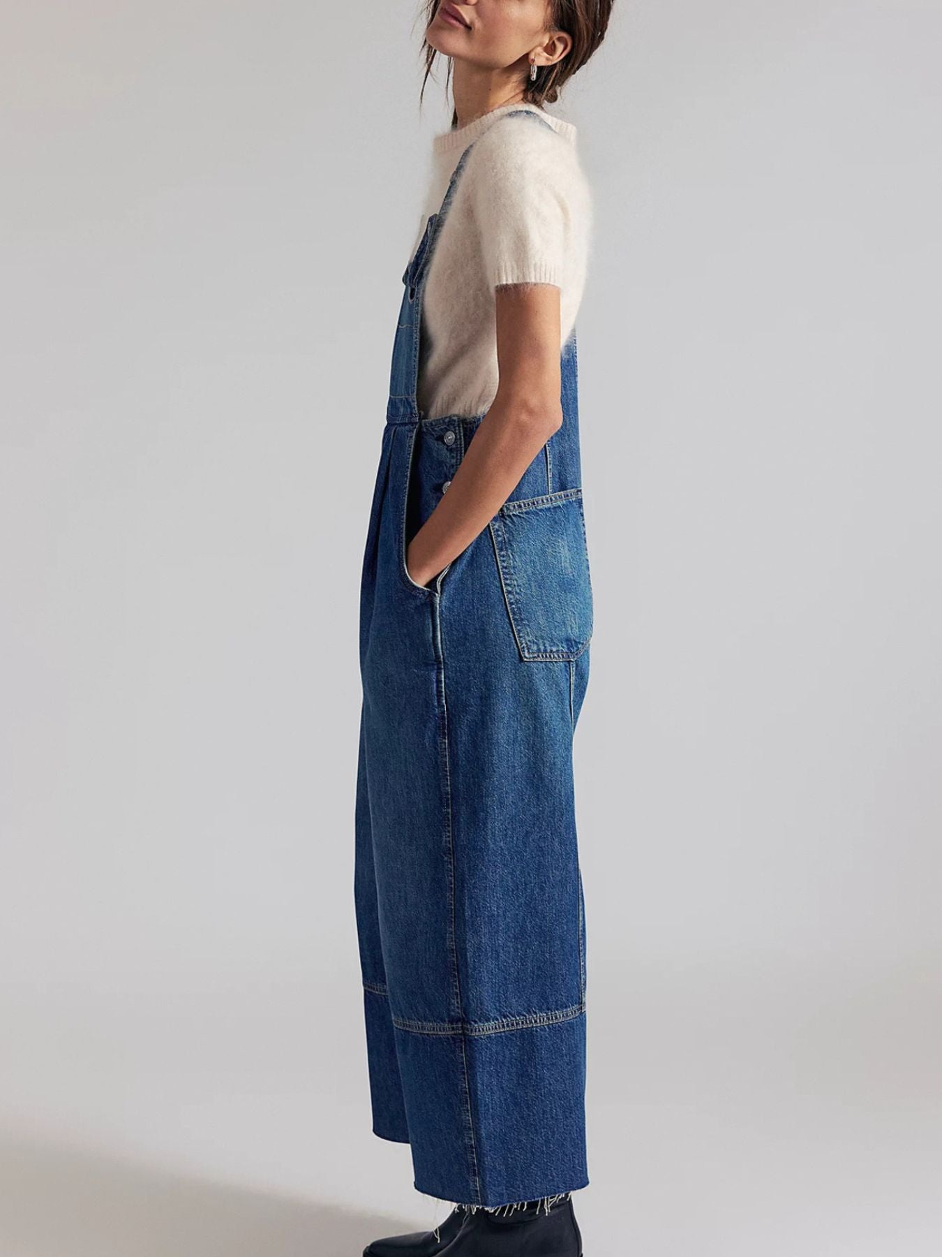 Lightweight raw hem wide-leg denim overalls jumpsuit by Trendsi with casual chic style, featuring relaxed fit and classic dungaree design.