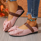 Women's chic bow round toe slip-on flats made of vegan leather, featuring a stylish design and comfortable fit by Trendsi.