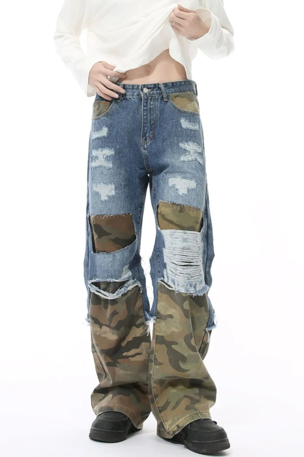 Distressed camouflage patchwork jeans by Trendsi featuring ripped details, camouflage patterns, and a trendy, casual fit.