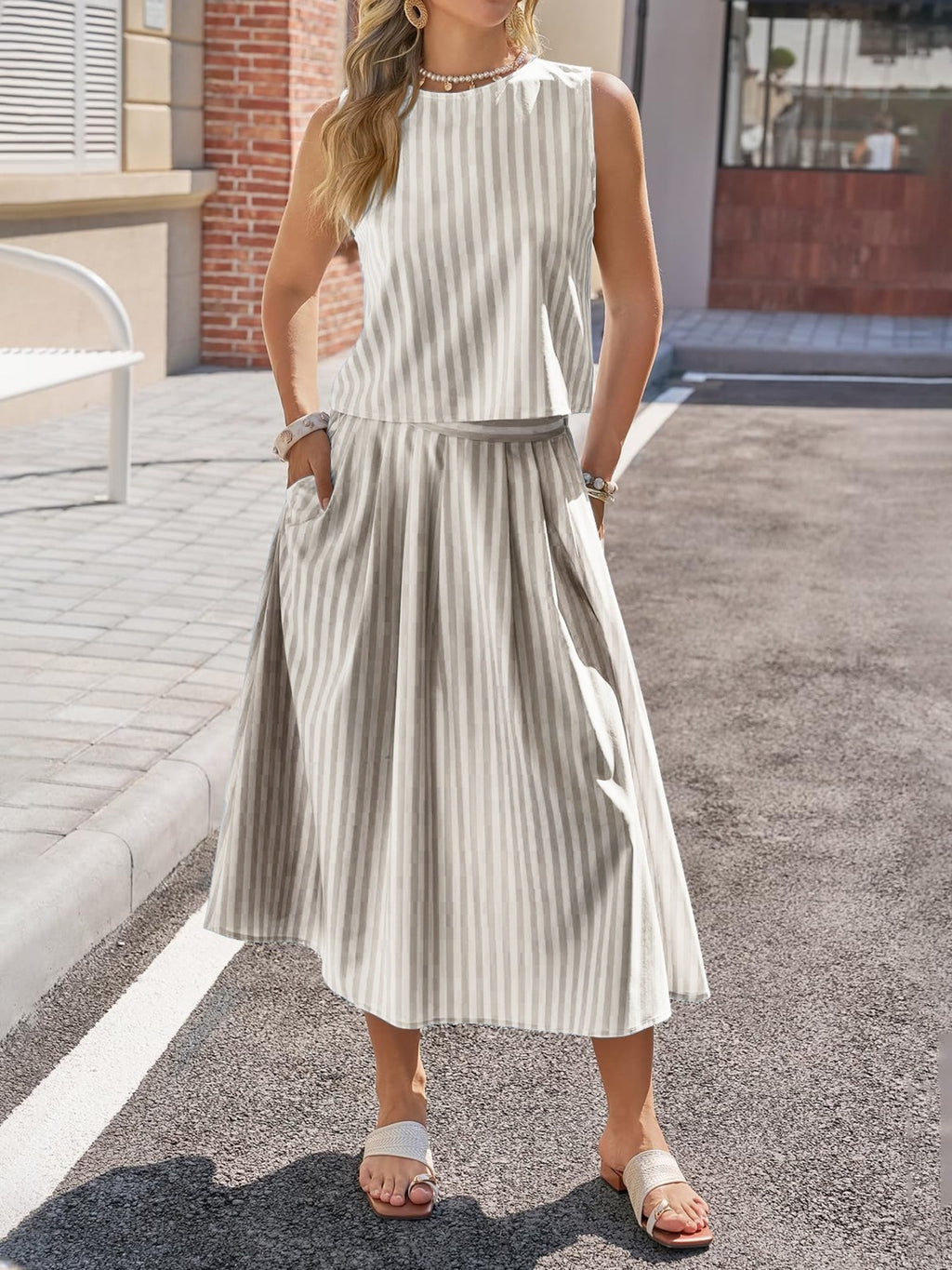 Women's striped sleeveless top and midi skirt two-piece set by Trendsi, featuring a stylish and comfortable summer outfit.