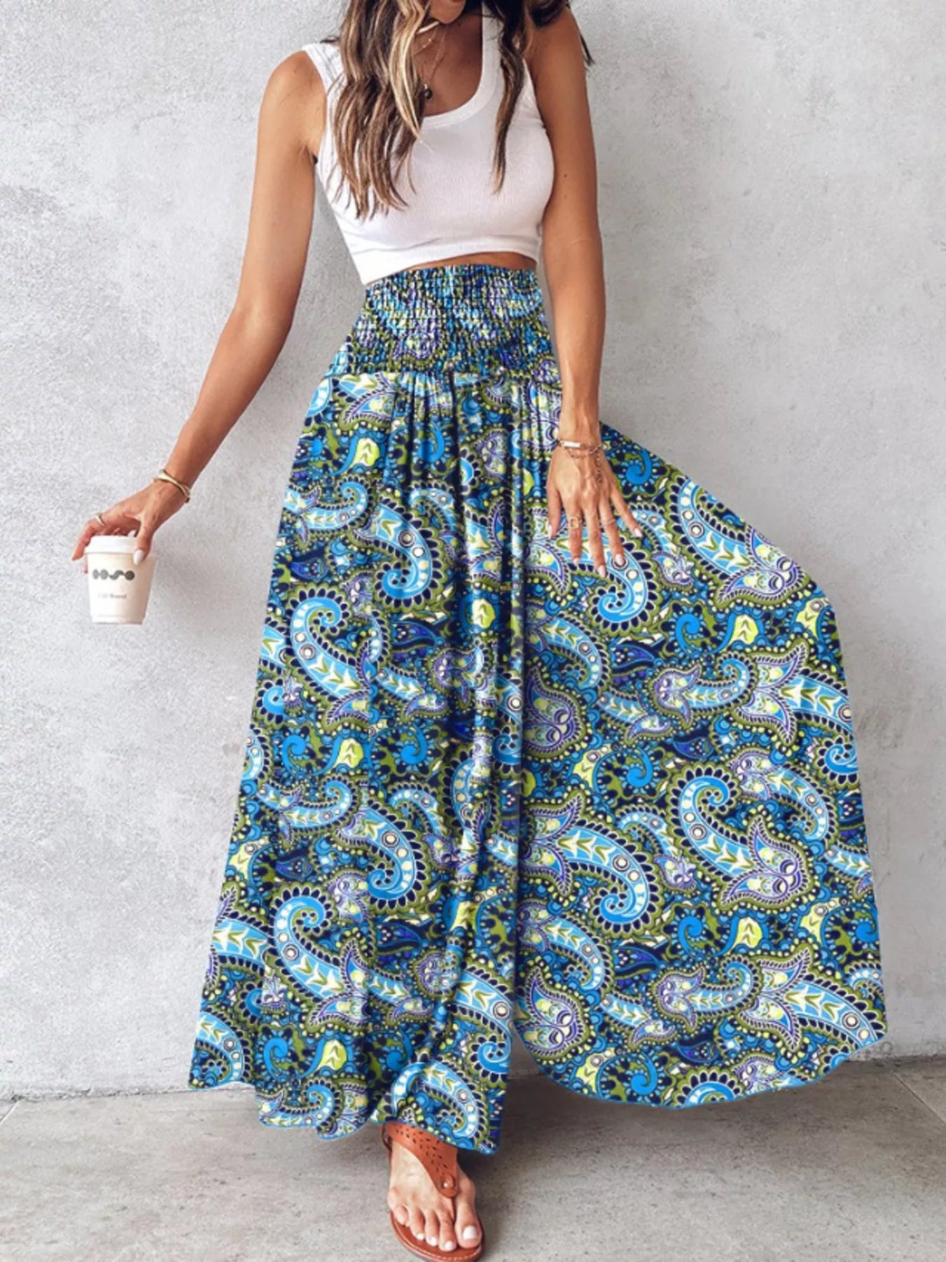 Printed wide-leg pants from Shopimist featuring a relaxed fit and vibrant floral pattern, shown on a model.