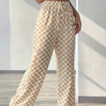 Checkerboard high-waisted wide-leg pants by Plush Fashion Hub in four colors, shown in a stylish front view.