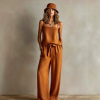 Women's casual two-piece set with spaghetti strap cami top and wide-leg pants by FitiqueFit, shown in a relaxed outfit.