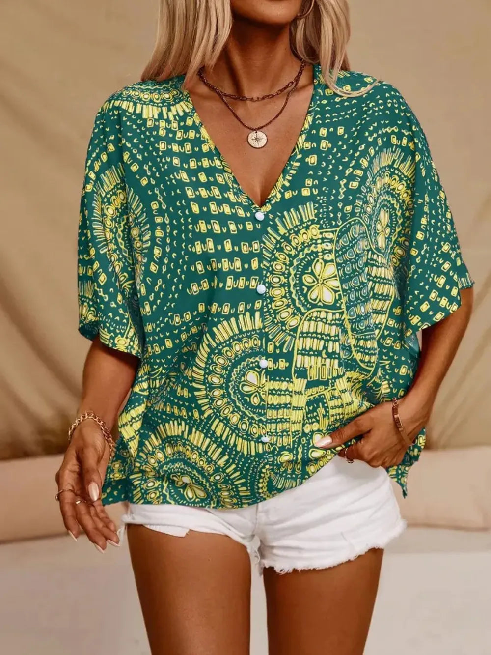 Women’s printed V-neck half sleeve casual top by Plush Fashion Hub, soft stretch fabric, stylish office blouse.