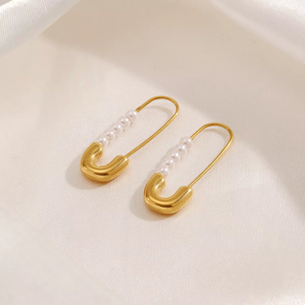 Safety pin pearl accent earrings featuring small pearls on minimalist safety pin design, stylish jewelry by Shopimist.