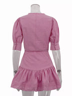 Puff sleeve cropped top and ruffled skirt set by Shopimist, featuring feminine design and lightweight fabric.