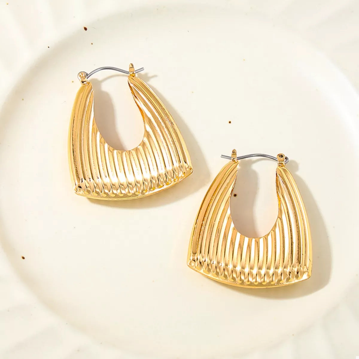 Gold-plated alloy ribbed triangular hoop earrings with a geometric design, perfect for stylish accessories.