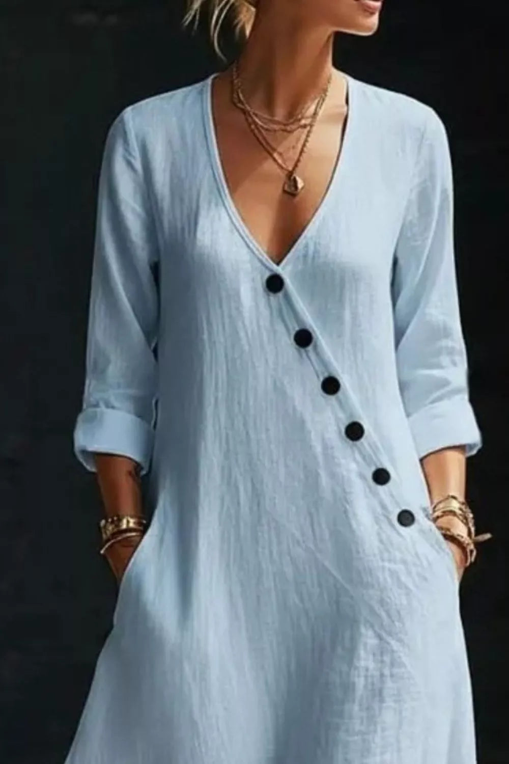 Long sleeve surplice maxi dress by Trendsi, featuring a flowing silhouette and elegant design, shown on a model.
