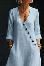 Long sleeve surplice maxi dress by Trendsi, featuring a flowing silhouette and elegant design, shown on a model.