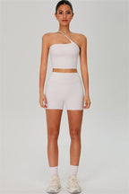 Fitglutes activewear one-shoulder crop top and matching shorts 2-piece set, designed for gym and workout wear.