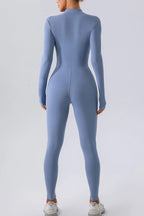Trendsi half zip mock neck active jumpsuit in black, featuring a fitted design and athletic style for workout or casual wear.