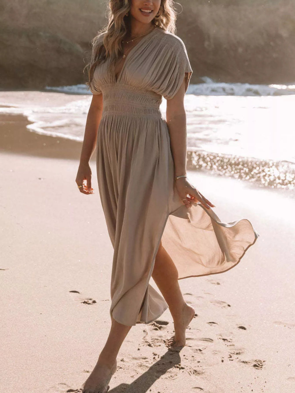 Plus size maxi dress by Trendsi featuring a full-size slit, V-neck, smocked waist, and elegant design.