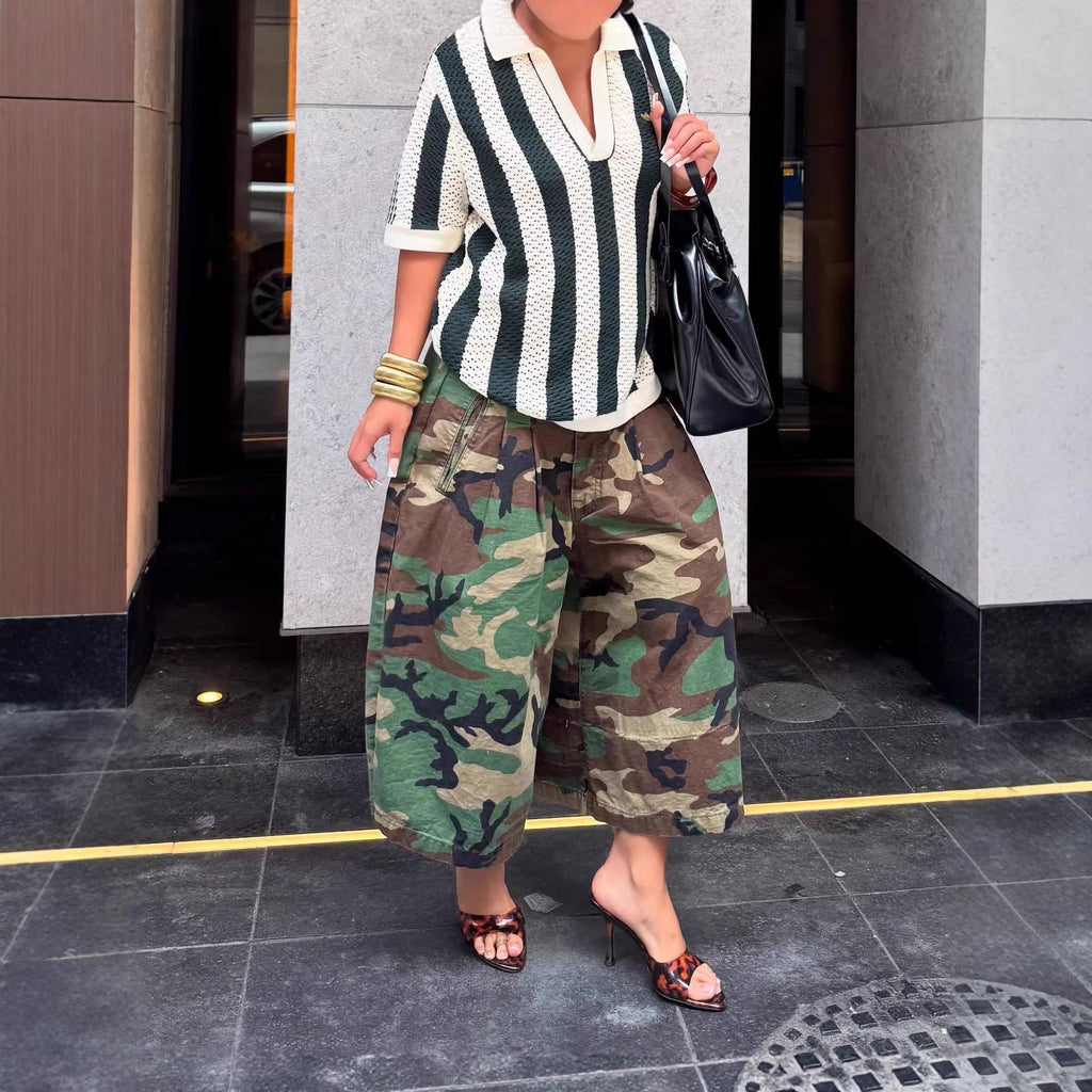 Women's wide-leg cargo pants with zipper and button detail from Plush Fashion Hub, featuring multiple pockets and a relaxed fit.