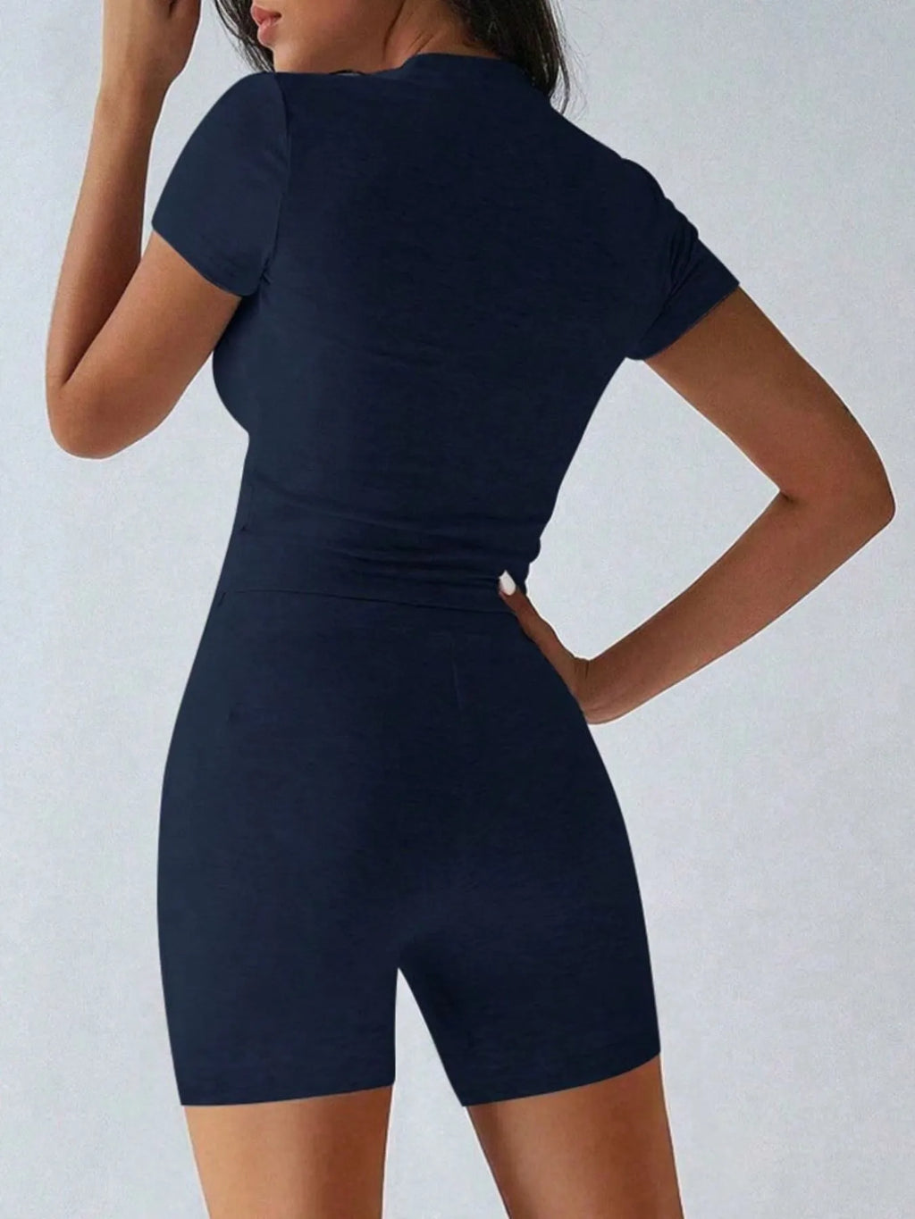 Trendsi activewear set with a round neck short sleeve top and matching shorts, ideal for casual and workout wear.