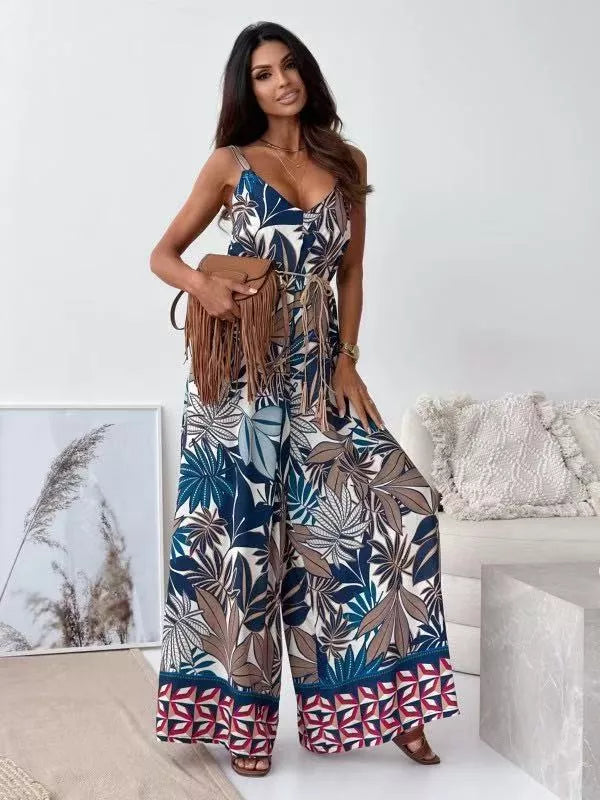 Printed spaghetti strap wide-leg jumpsuit by Plush Fashion Hub, featuring a stylish design and flowy fabric for a chic look.
