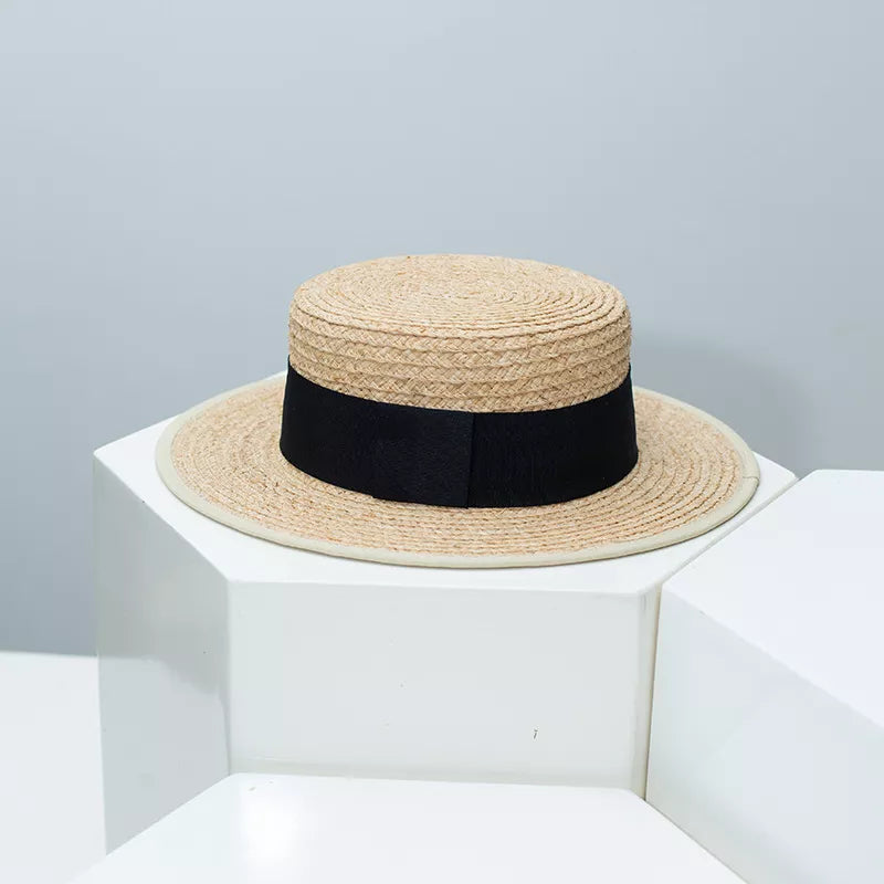 Straw boater hat with black contrast band by Plush Fashion Hub, perfect for summer style and sun protection.