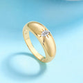 Sterling silver Moissanite ring with sparkling gemstone, featuring a sleek band and elegant design.