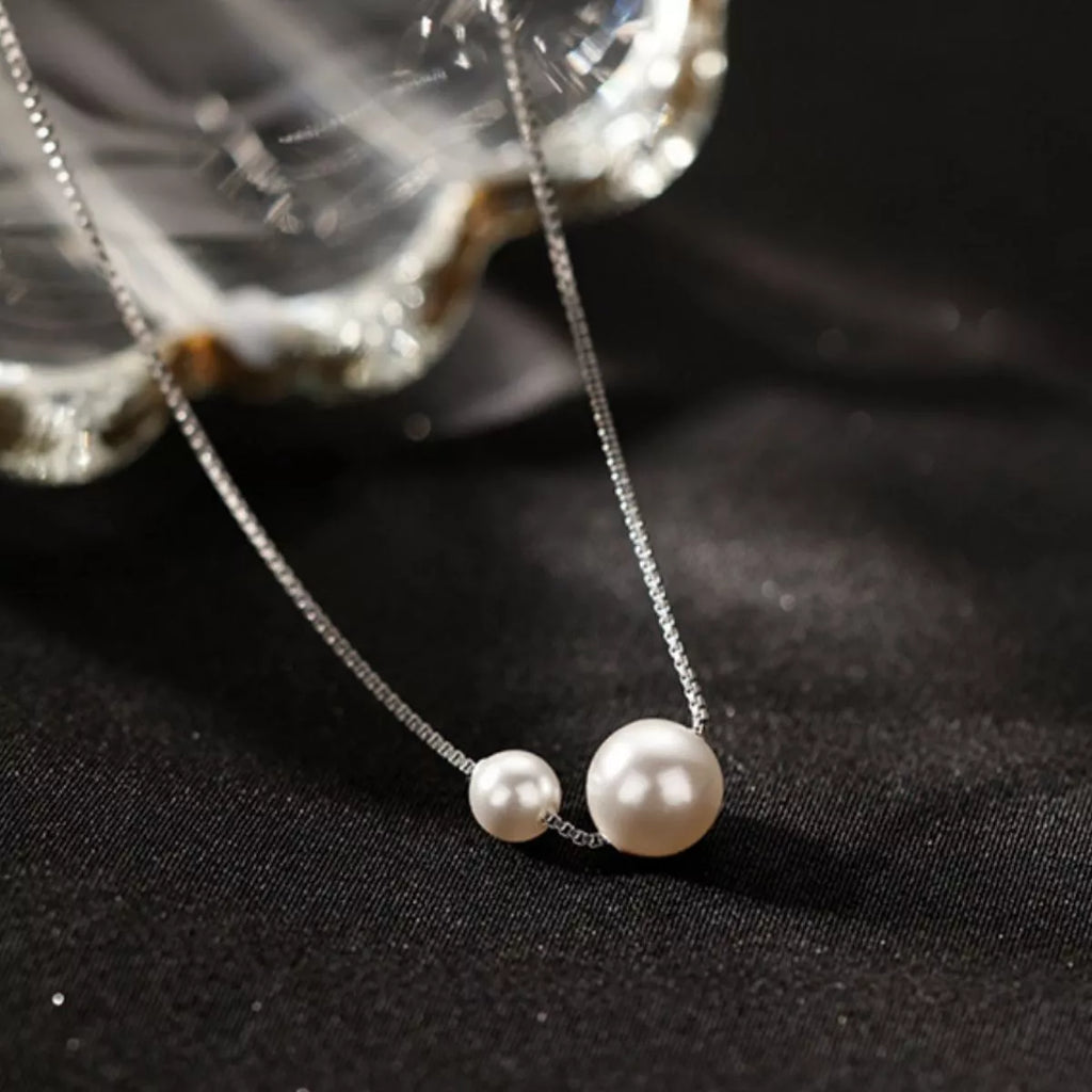 925 Sterling Silver Pearl Necklace with round freshwater pearls on a delicate silver chain, showcasing elegant jewelry design.