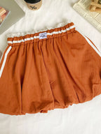 Lace trim elastic waist mini skirt by Trendsi showcasing a stylish fitted design with delicate lace details.