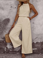 Women's sleeveless vest and casual pants two-piece set by Plush Fashion Hub, featuring a draped neck and relaxed fit for casual wear.