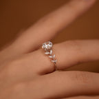 Sterling silver leaf ring with a 1-carat moissanite gemstone, elegant jewelry piece showcasing intricate leaf design.