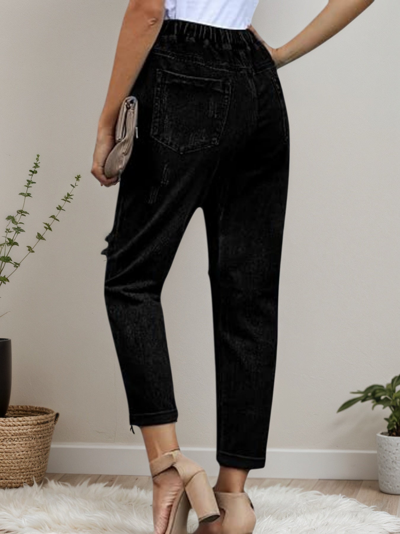Women’s distressed stretch denim joggers with casual elastic waist, featuring distressed details and a comfortable fit from Plush Fashion Hub.