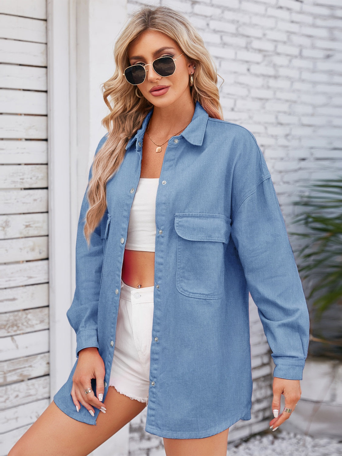 VYSN denim shacket with dropped shoulders and pocketed snap-down front, featuring a casual, relaxed fit and stylish design.