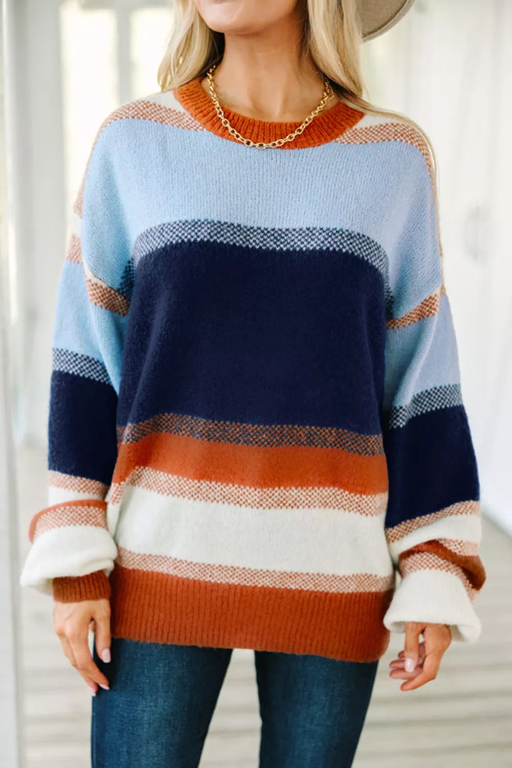 Color block round neck tunic sweater by Trendsi, featuring a cozy fit with bold color blocks and a classic round neckline.