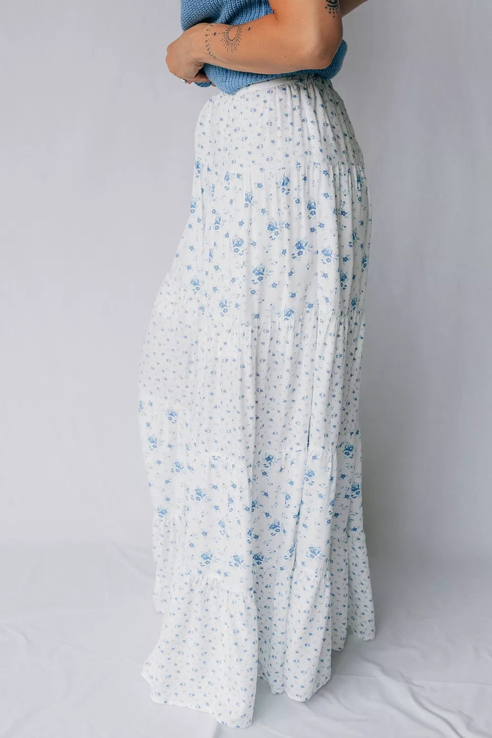 Women's high waisted floral boho maxi skirt with flowy tiered viscose fabric, featuring a vibrant floral pattern and relaxed fit.