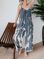 Full size Shopimist tie-dye wide-leg jumpsuit with a relaxed fit, featuring vibrant colors and a comfortable, flowing silhouette.