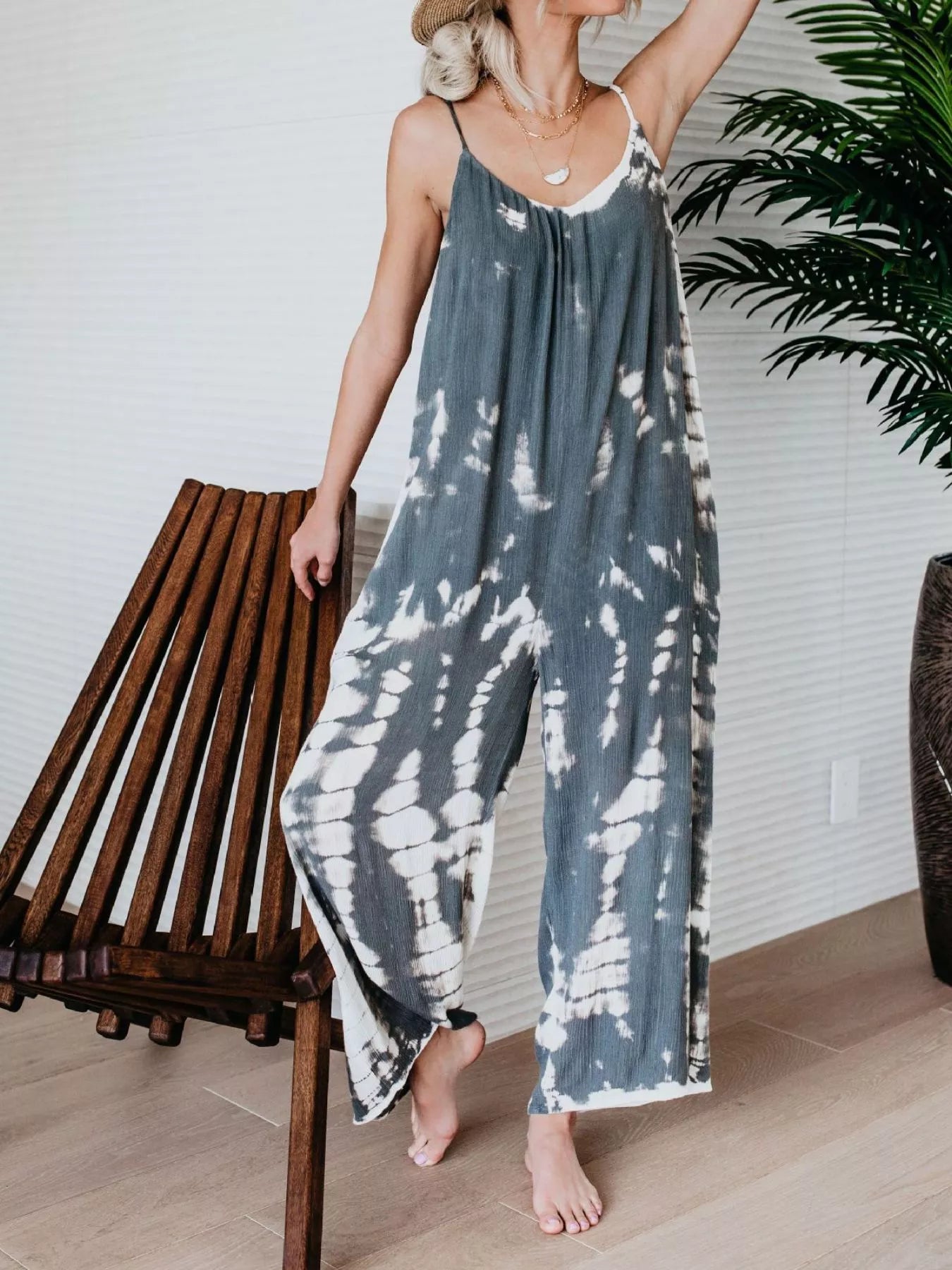 Full size Shopimist tie-dye wide-leg jumpsuit with a relaxed fit, featuring vibrant colors and a comfortable, flowing silhouette.