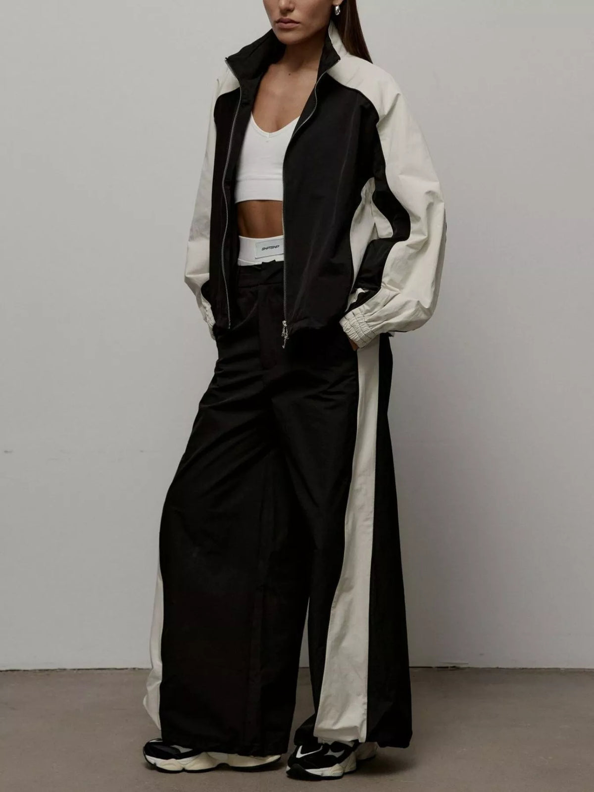 Color block zip-up outerwear and pants set by Plush Fashion Hub, featuring a vibrant, stylish matching ensemble.