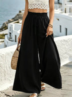 Wide leg drawstring pants from Plush Fashion Hub, featuring a relaxed fit, soft fabric, and adjustable waist in a stylish design.