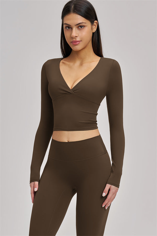 Fitglutes Activewear long sleeve crop top with fitted design, featuring a soft fabric and stylish crew neckline for gym and workout.