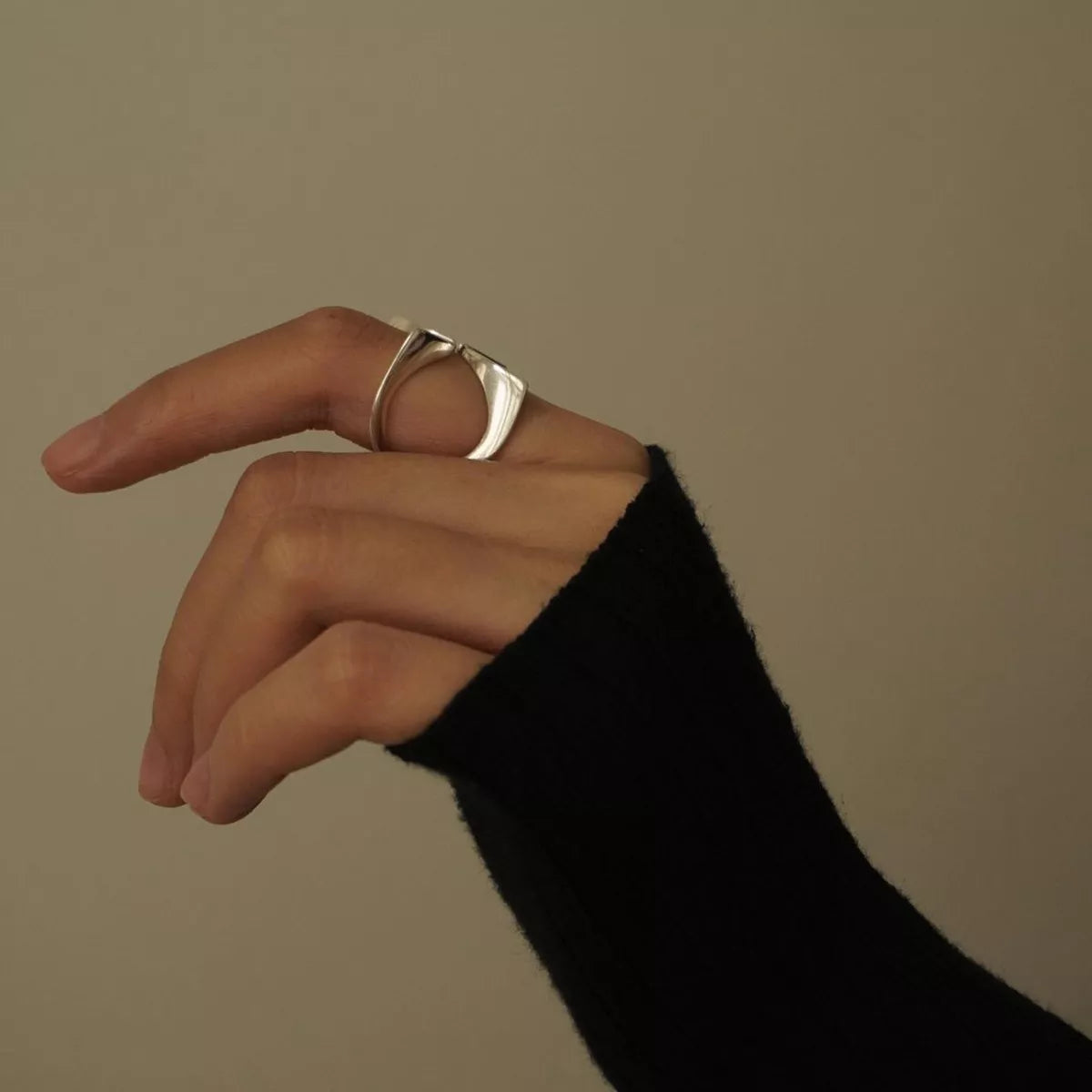 Stainless steel crisscross open ring from Plush Fashion Hub, featuring a modern, stylish design with interwoven band details.