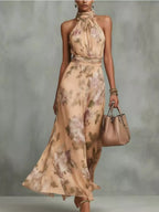 Plus size floral print sleeveless maxi dress by Trendsi, full-length dress with vibrant floral pattern, perfect for summer or casual wear.