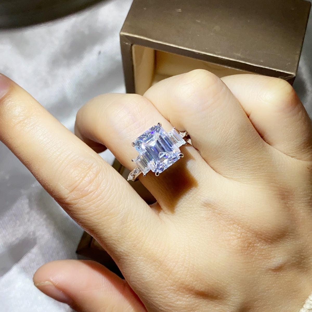 Sterling silver ring with a 5-carat moissanite gemstone, elegant jewelry piece with shiny silver band and sparkling center stone