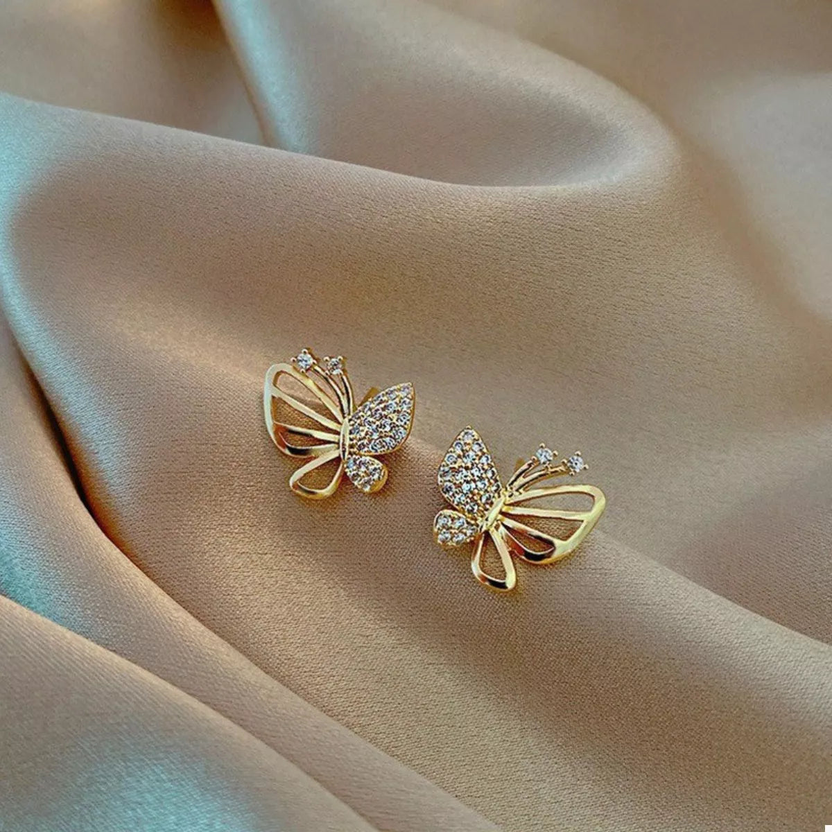 18K gold-plated butterfly stud earrings with delicate wing details and a polished finish, perfect for everyday wear and elegant looks.