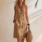 Women's casual FitiqueFit resort V-neck sleeveless midi dress with asymmetrical button detailing on a light fabric.