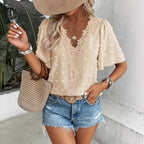 Women's V-neck lace-trim Swiss dot short-sleeve top by Plush Fashion Hub, casual loose fit with delicate lace accents.