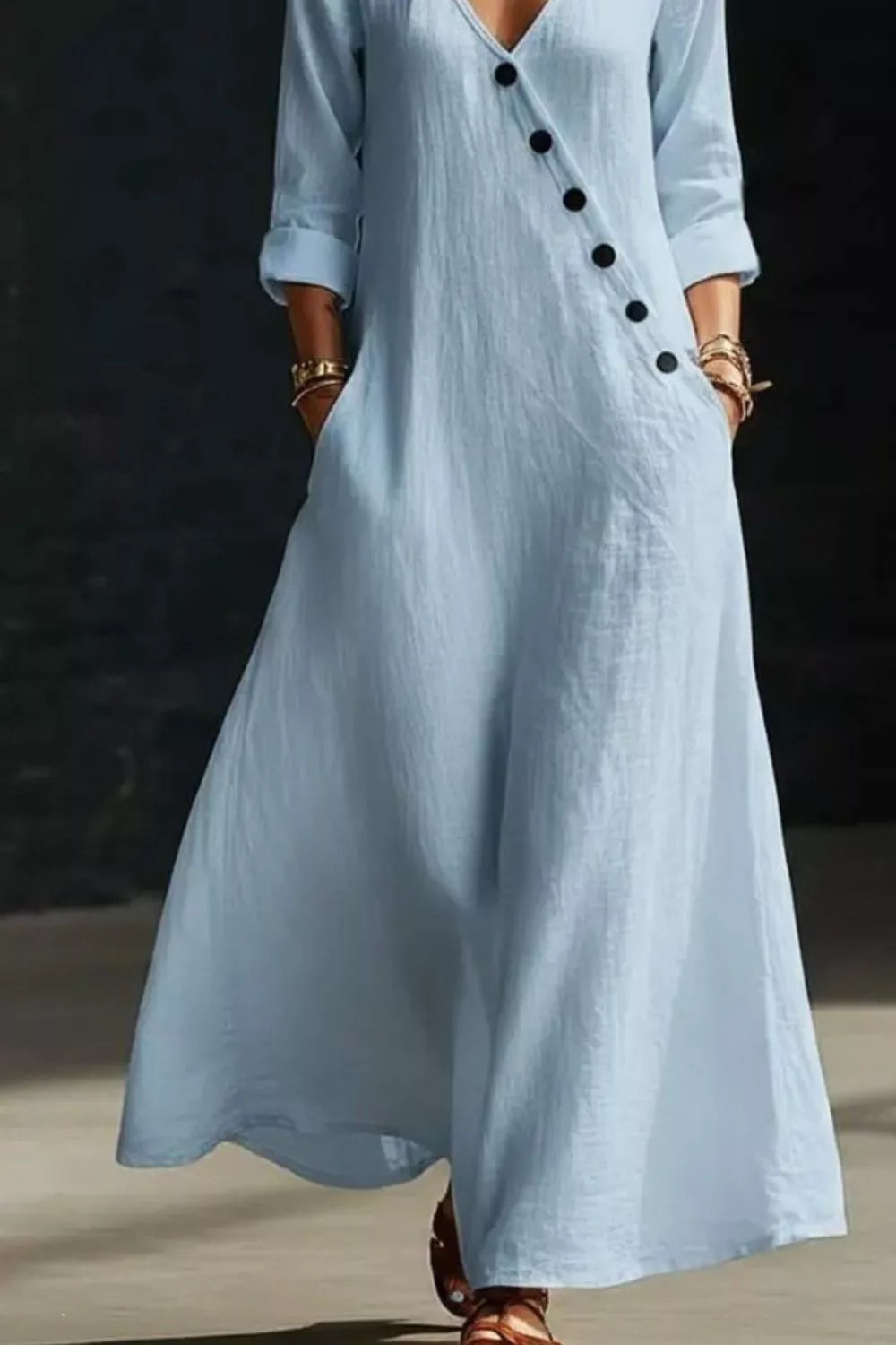 Surplice long sleeve maxi dress by Trendsi featuring a flowing silhouette and elegant design in soft fabric.