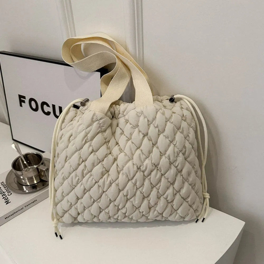 Shopimist drawstring tote bag with bubble textured surface, spacious bag with adjustable drawstring closure and modern style.