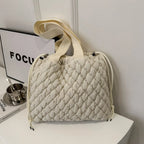 Shopimist drawstring tote bag with bubble textured surface, spacious bag with adjustable drawstring closure and modern style.