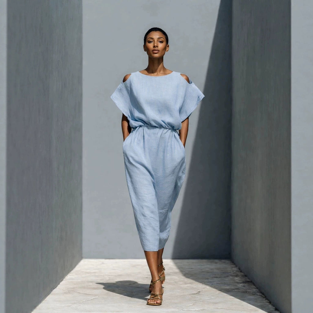 Women's off-shoulder batwing sleeve maxi dress by FitiqueFit with elastic waist and flowy silhouette, shown on model.