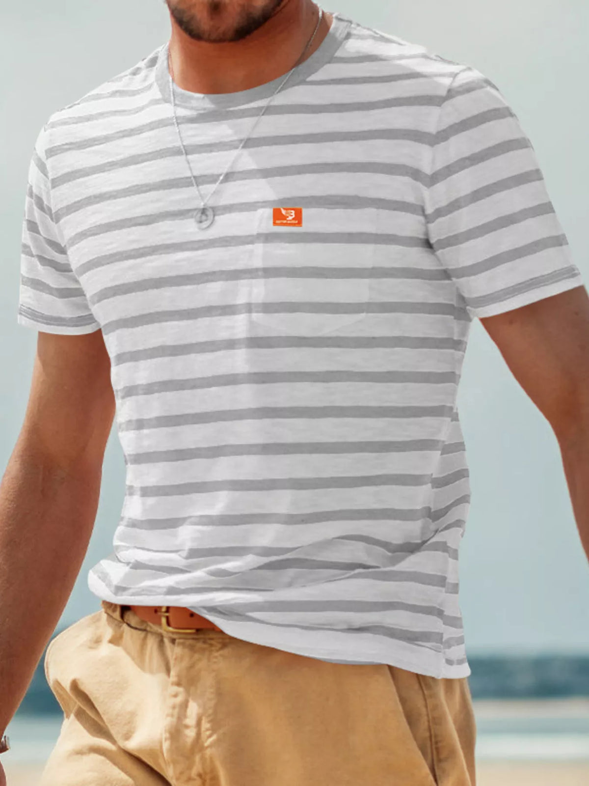 Men's plus size striped pocket short sleeve t-shirt by Plush Fashion Hub, featuring a casual design with front pocket and bold stripes.