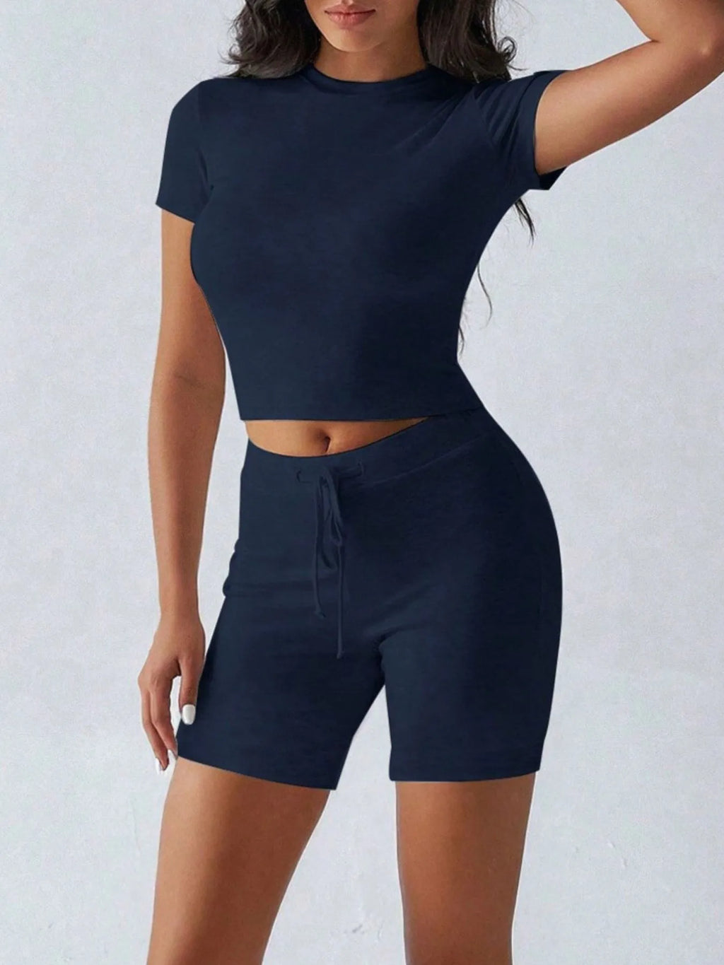 Trendsi active wear set with a round neck short sleeve top and matching shorts, perfect for casual or workout wear.