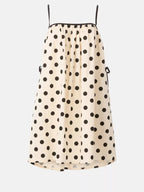 Polka dot spaghetti strap mini dress by Shopimist, featuring a playful pattern and lightweight fabric, perfect for summer wear.