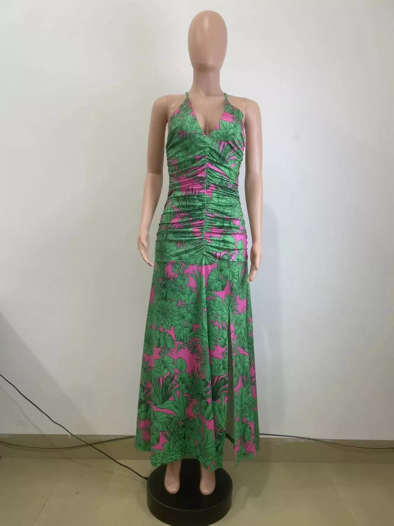 Printed halter neck maxi dress by Shopimist featuring a flowing silhouette and vibrant floral pattern.
