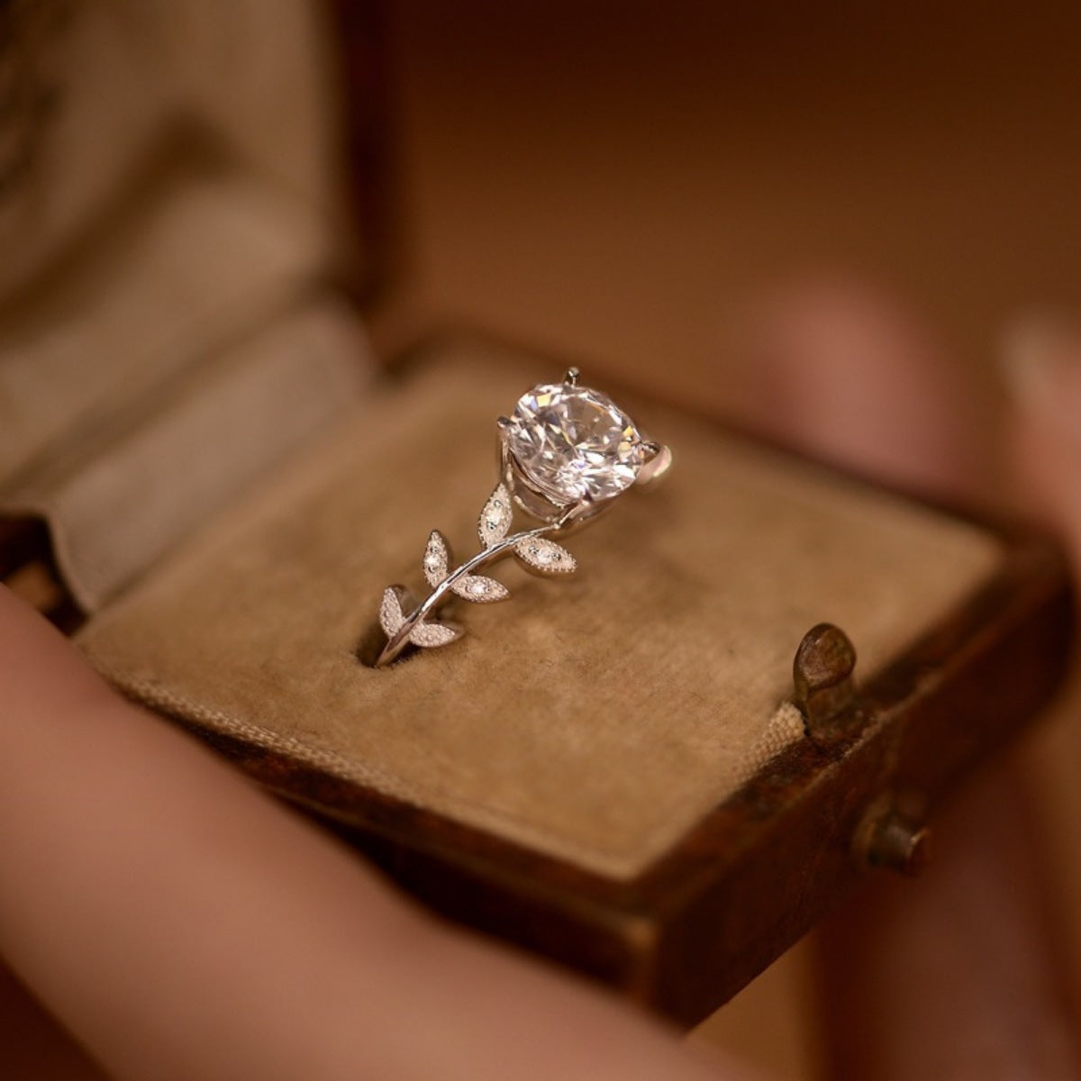 Sterling silver leaf ring with 1 carat moissanite gemstone, elegant jewelry by Plush Fashion Hub.